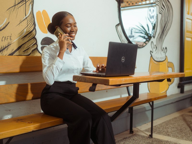 Woman talking on the phone at a cafe