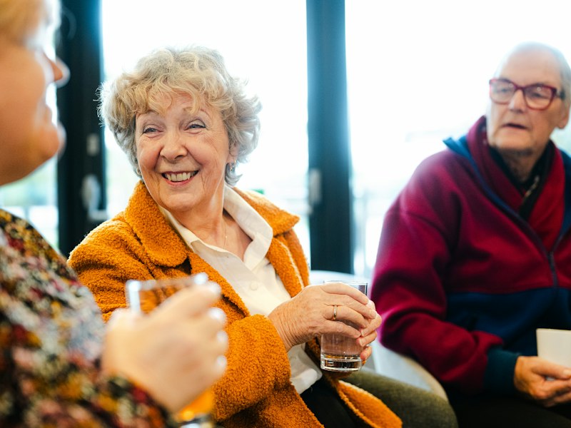 Smiling seniors chatting together