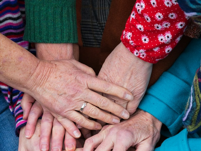 Hands stacked together in teamwork